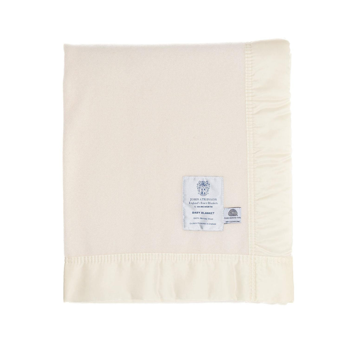 A finely woven, cream, pure Merino wool baby blanket, bound on all four sides with a silky cream satin trim. Made in England.
