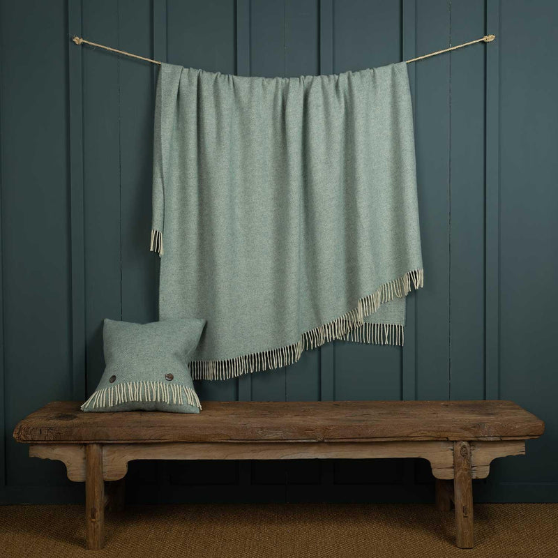Shetland Wool Throw in Duck Egg Green colour, herringbone pattern with fringe top and bottom, size is 140 CMS by 185 CMS.