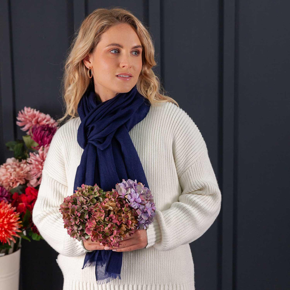The sublimely soft premium cashmere ring shawl in classic navy is woven in a classic twill weave and finished with a short self-fringe. Size 90 x 200 CMS. Made in Nepal.