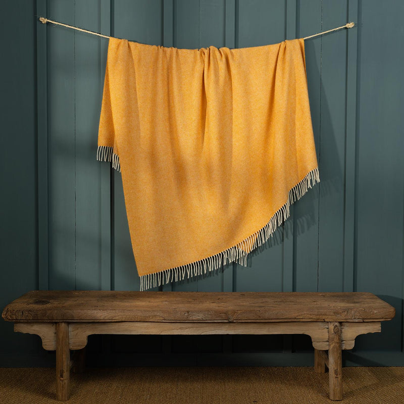 Shetland wool herringbone throw draped to show colour and fringe.