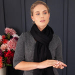 Luxuriously soft merino and silk shawl in a Black twill weave with a soft fine fringe generous size light and airy beautifully warm best-quality