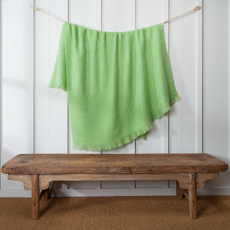 Mohair Throw in light green, with a fringe top and bottom, size is 130 CMS by 180 CMS.