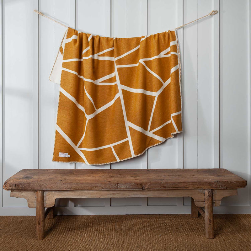 Cotton throw in Ochre and White pattern, reversible. blanket stitch finish, size is 140 CMS by 160 CMS.