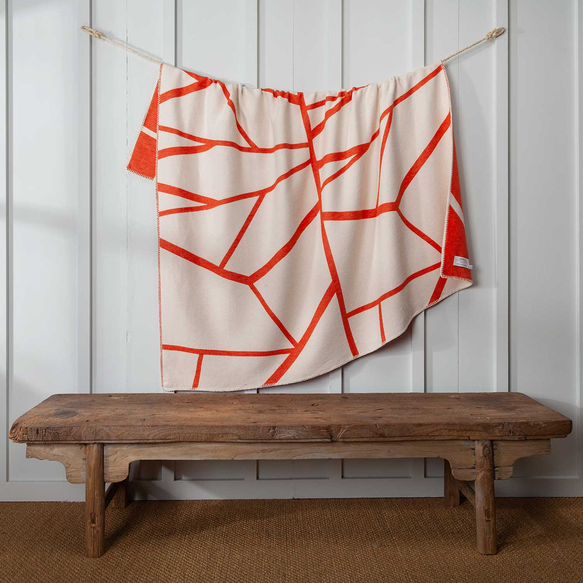 Reverse side of throw in white and Orange pattern.