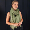 Luxuriously soft merino and silk shawl in khaki twill weave with a soft fine fringe generous size light and airy beautifully warm best-quality By The Wool Company