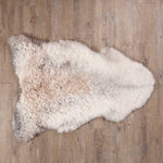 Undyed, shorn Icelandic sheepskin, greys, and browns flecked through a natural white soft fleece, From The Wool Company 