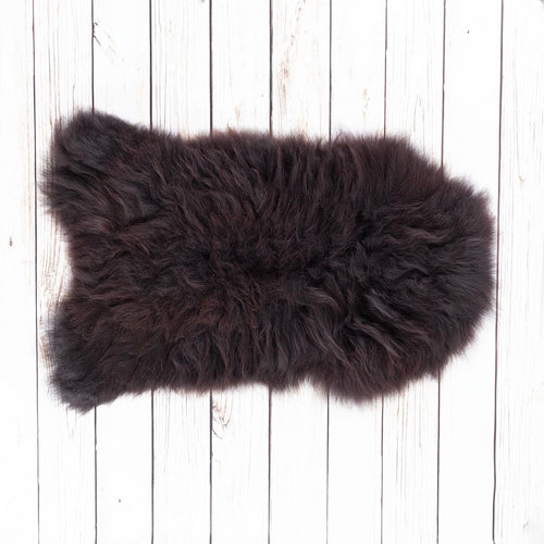 The Wool Company -Eco Tanned Seconds Natural Black Sheepskin -  These are good enough to use around your home, garden, or as a large pet bed. Natural black undyed sheepskin, with varying tones of very dark brown to black running through the fleece.