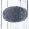 Silky soft, thick, & supportive luxury shorn dyed small sheepskin oval pet bed in attractive colours From The Wool Company