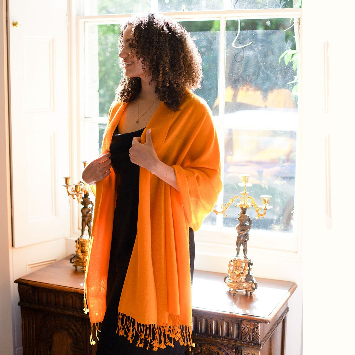 Genuine 100% cashmere pashmina in warm golden orange tones with tasselled fringe super-soft lightweight & warm finest-quality. Made in Nepal.