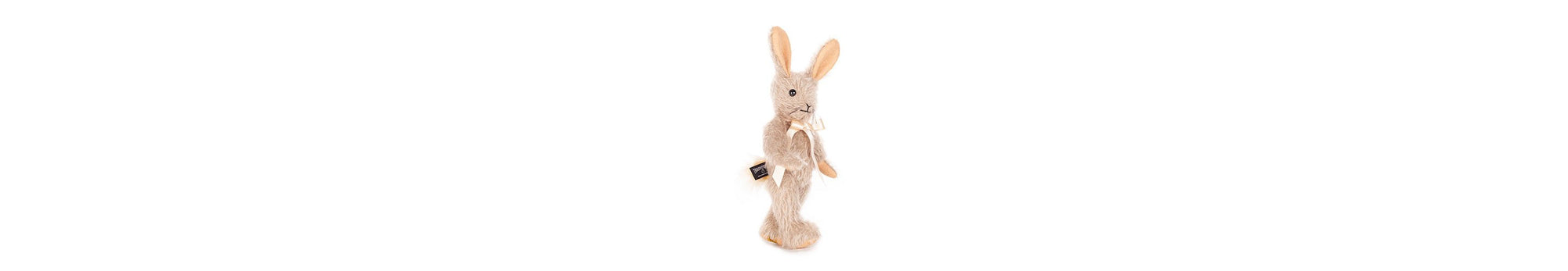 Binky Bunny teddy , stands at 9 inches tall. Fully jointed; soft dove grey mohair, with pinky-beige felt paws and inner ears.