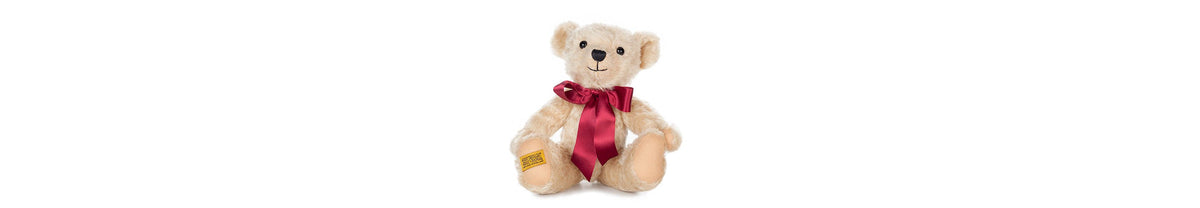  Henley teddy bear in his bow, stands at 12 inches tall. Fully jointed; soft rich cream mohair, with pinky-beige  felt paws.