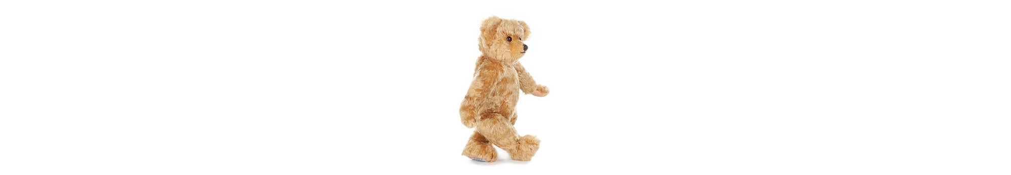 Little Edward Bear has a rich, antique golden mohair coat and sandy-beige pure woollen felt paws. He is11 inches tall. 