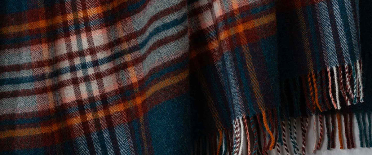 Pure new wool sofa and bed throws, knitted or woven in so many lovely colours and textures, in plain, and checked designs