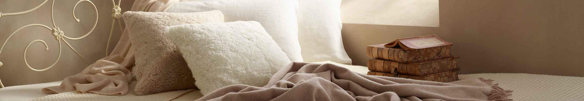 Gorgeous range of genuine sheepskin cushions, footstools, pouffes, and bean bags Short and long wool in contemporary colours
