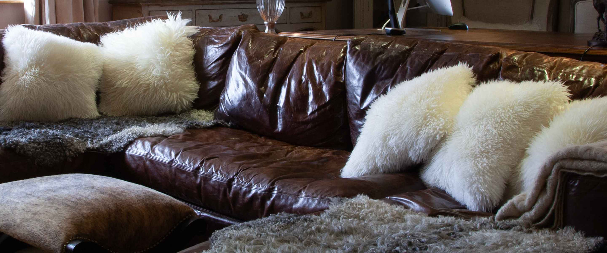 Gorgeous range of genuine sheepskin cushions, footstools, pouffes, and bean bags Short and long wool in contemporary colours