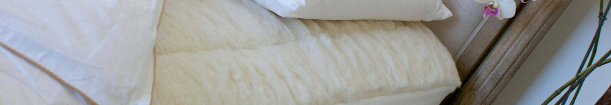 Wool mattress topper with deep Merino wool pile, luxury lambs wool filling, and wool pillow protectors with cotton casing  