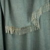 Shetland Wool Throw in Duck Egg Green, close up photo of pattern and fringe.