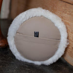 Sheepskin Doorstop in white curly sheepskin with ecru leather carry handle