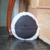 Sheepskin Doorstop in white curly sheepskin with dark brown leather base
