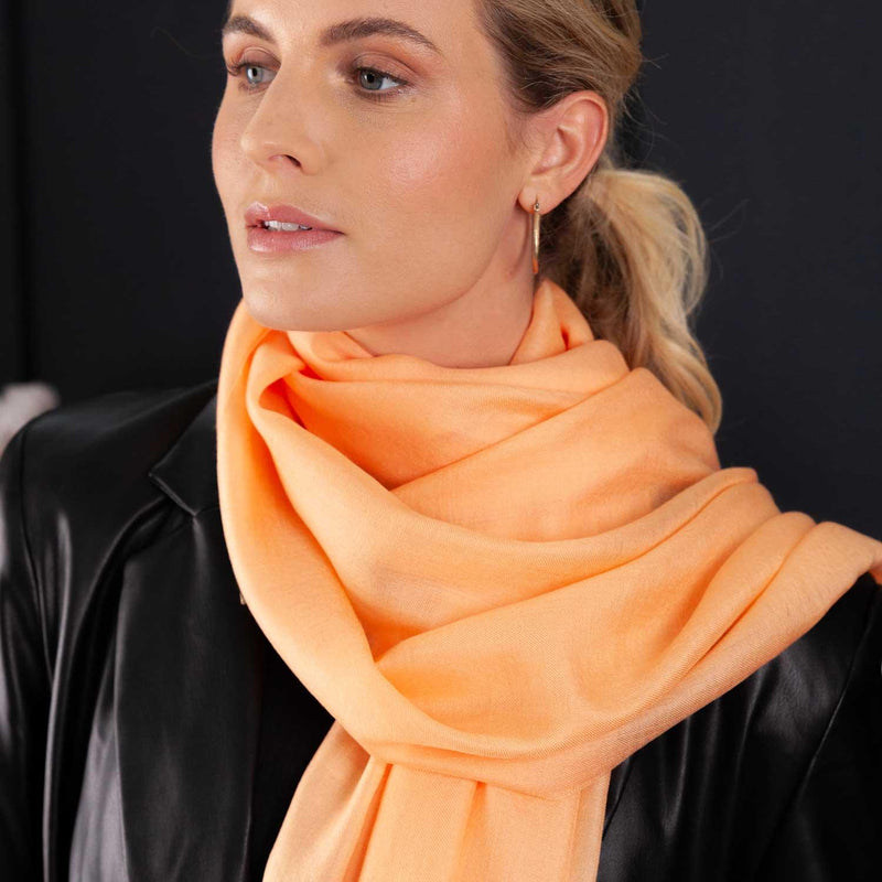 Luxuriously soft merino and silk shawl in peach twill weave with a soft fine fringe generous size light and airy beautifully warm best-quality
