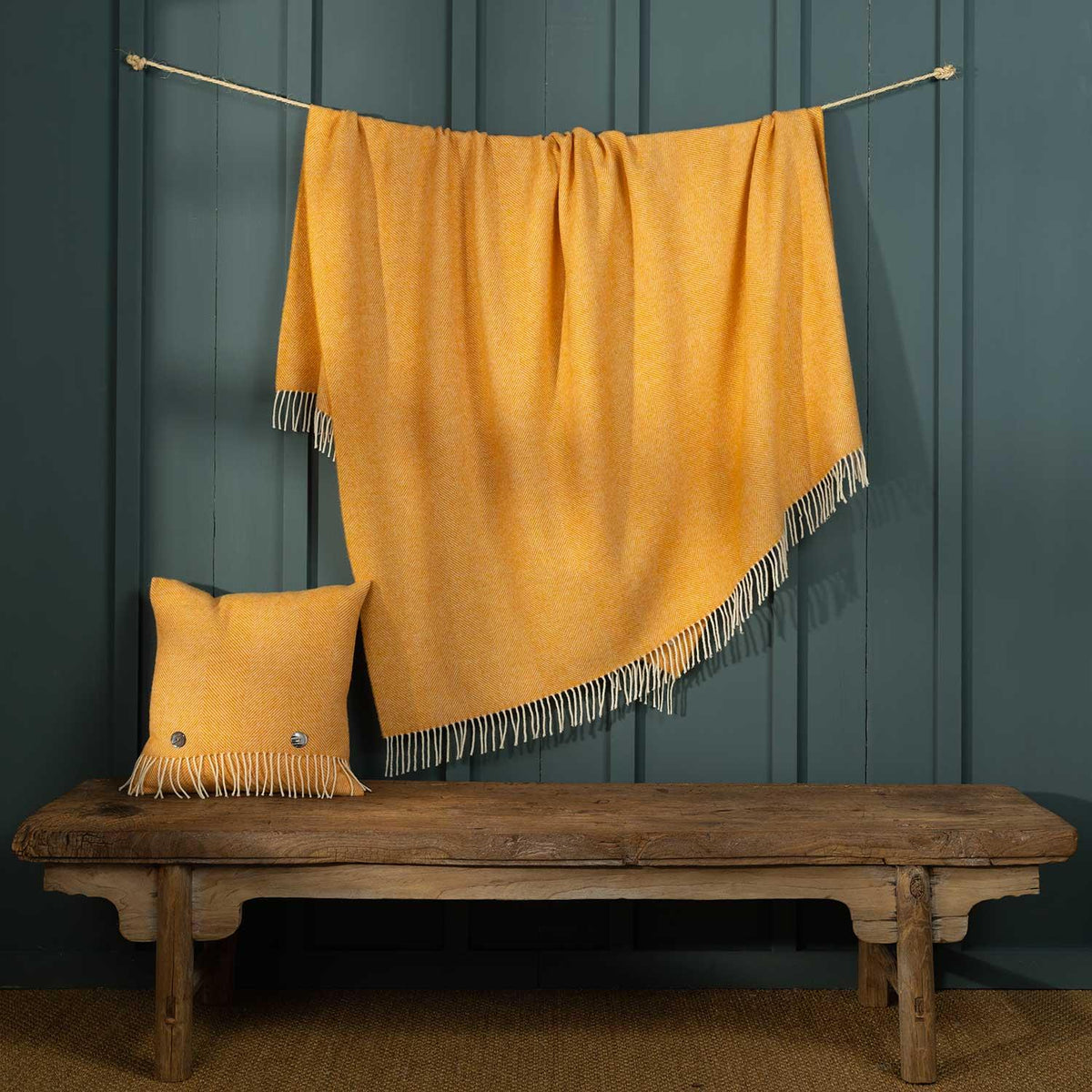 Shetland wool herringbone cushion in Marigold colour with cream fringing, size is 40 CMS by 40 CMS.