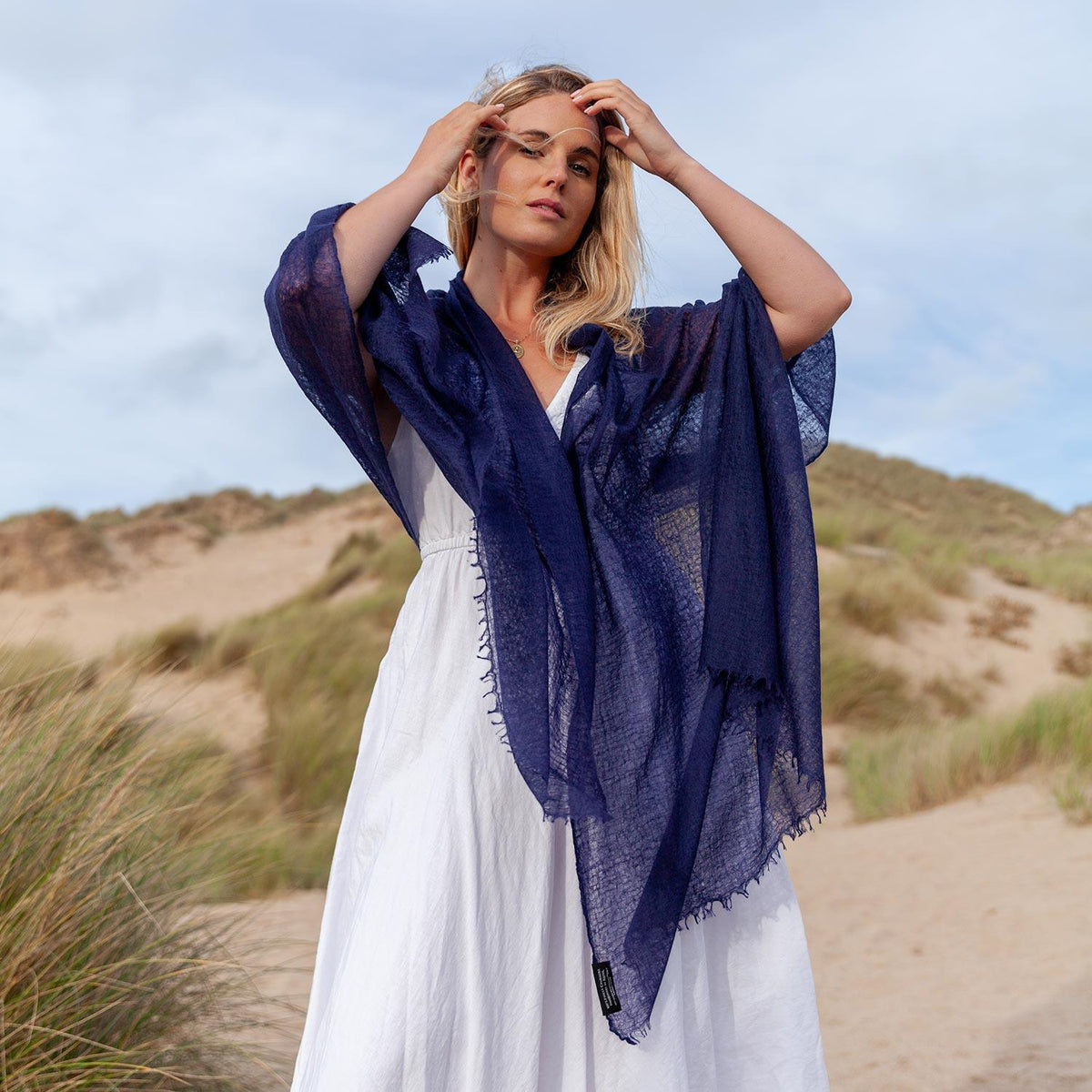 The Diaphanous Pashmina Navy. The felted yarn enhances both the softness and structure. Worn casually draped around the shoulders. 90 x 200 CMS.