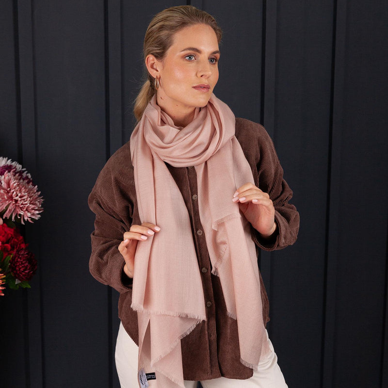 Luxuriously soft merino and silk shawl in rose gold twill weave with a soft fine fringe generous size light and airy beautifully warm best-quality By The Wool Company