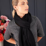 Luxuriously soft merino and silk shawl in a Black twill weave with a soft fine fringe generous size light and airy beautifully warm best-quality