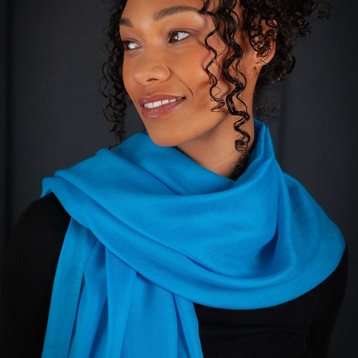 Luxe Merino and Silk shawl in Dark Turquoise, soft, light and warm, this elegant shawl can be worn to compliment casual or evening outfits, size is 90 CMS by 190 CMS.