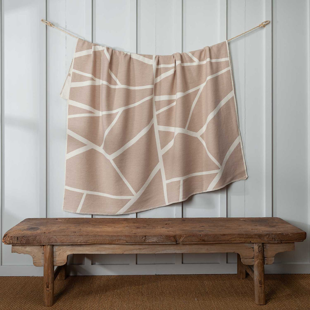 Cotton Throw with pattern in Latte and white, whip stitching on edges, size is 140 CMS by 160 CMS.
