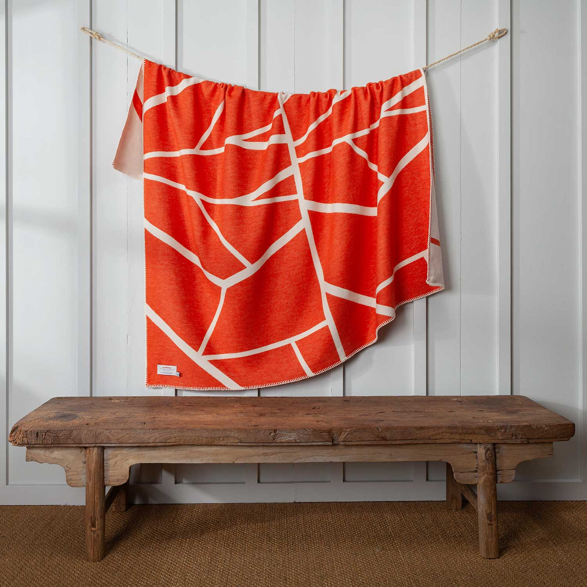 Cotton Throw in Orange and white pattern, reversible, whip stitch edging, size is 140 CMS by 160 CMS.