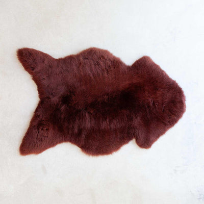 Sheepskin small, average size is 80 to 90 CMS Long X 45 to 60 CMS wide,  Autumn colour with beautiful burgundy tone.