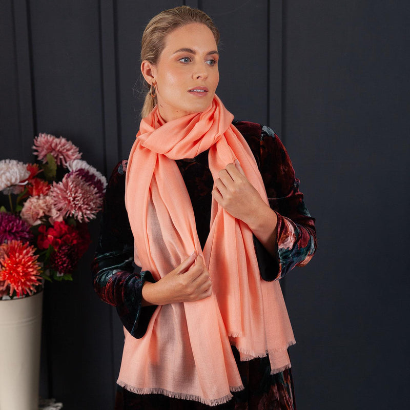 Luxuriously soft merino and silk shawl in coral twill weave with a soft fine fringe generous size light and airy beautifully warm best-quality By The Wool Company
