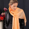 Luxuriously soft merino and silk shawl in peach twill weave with a soft fine fringe generous size light and airy beautifully warm best-quality By The Wool Company