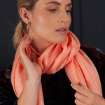 Luxuriously soft merino and silk shawl in coral twill weave with a soft fine fringe generous size light and airy beautifully warm best-quality