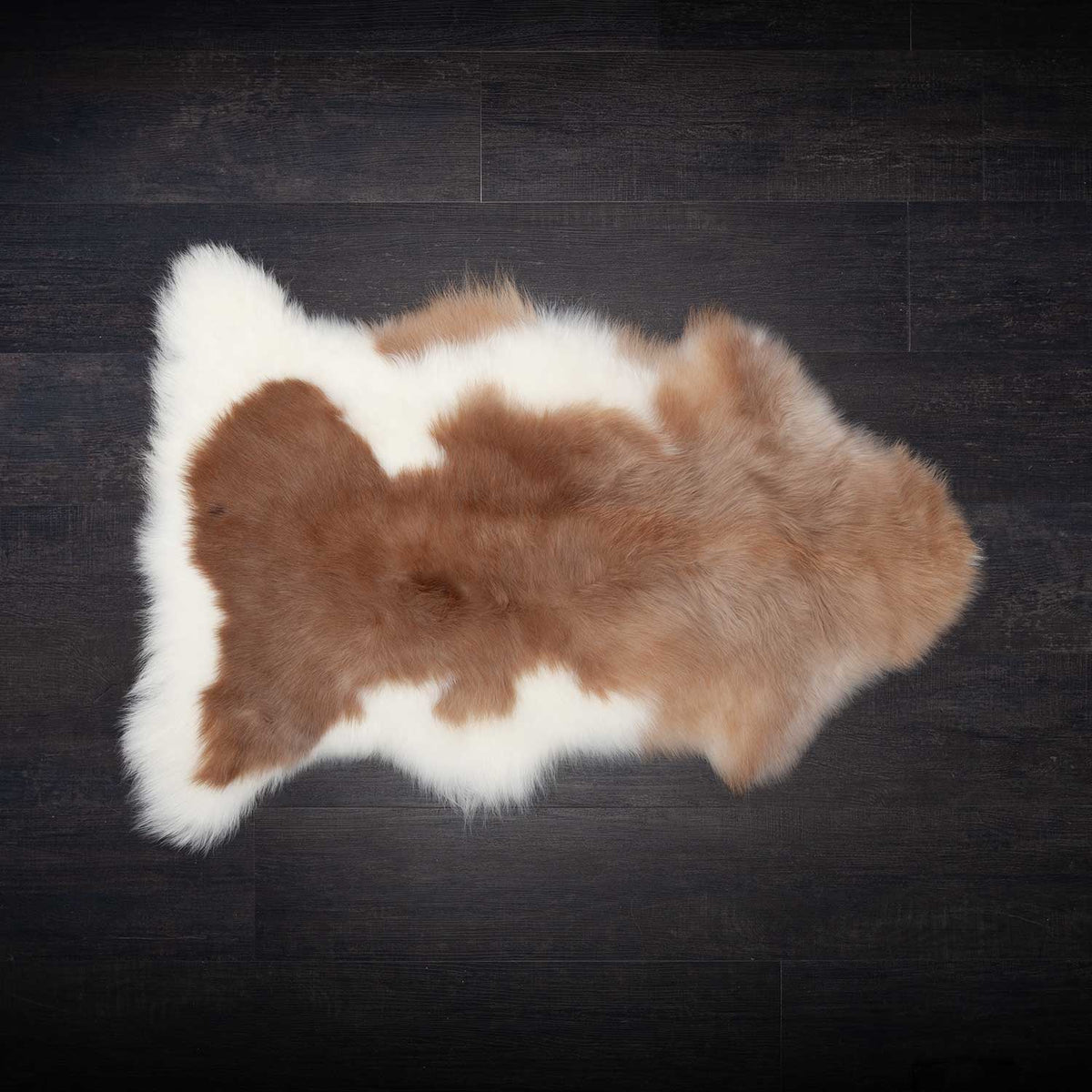 Natural Undyed Himalayan Sheepskin Rug in mix of creams and browns. The fleece is fine, silky and lightweight, with a fleece length of up to 10CMS. Tanned and hand-finished in Devon.