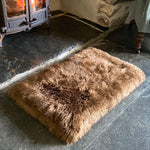 Medium super-soft & silky longwool fleece padded sheepskin pet bed non-slip backing warm brown tones By The Wool Company