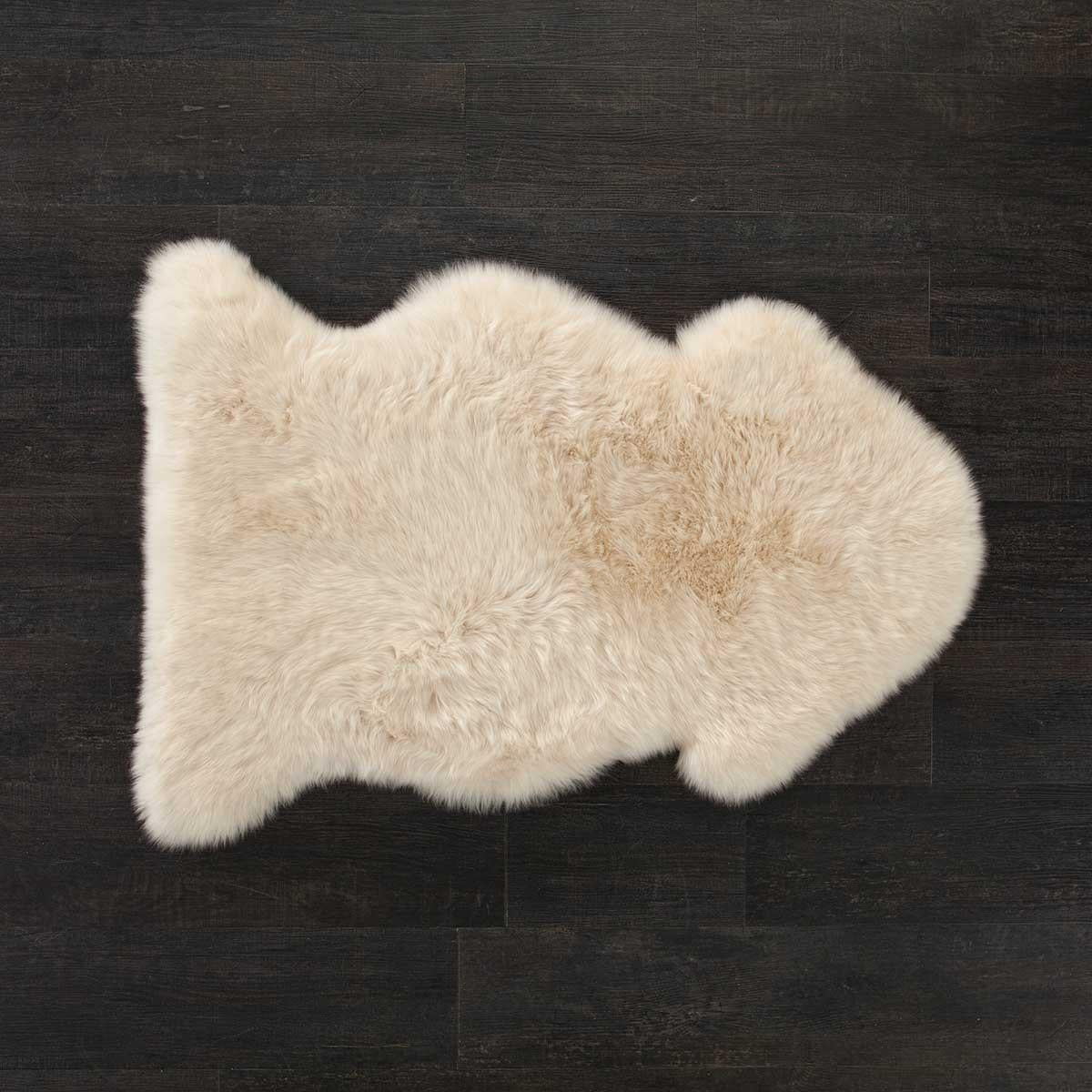 British single Linen colour dyed longwool sheepskin rug soft cream & caramel tones super silky-soft fleece approx 100 x 70 CMS.