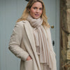 Luxury cashmere pashmina shawl in a soft light beige colourway and finished with hand-twisted tassels. Size 90 x 200 CMS.