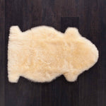 Super soft & luxurious baby lambskin in a soft oaten colour,  shorn down to 35mm for extra support. From The Wool Company