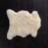Undyed Ivory coloured sheepskin, dense, silky fleece, comfortable and supportive. Quality British sheepskin.