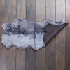 Double size British shorn sheepskin throw in shades of grey, silver, & charcoal. Extremely soft and beautifully finished 
