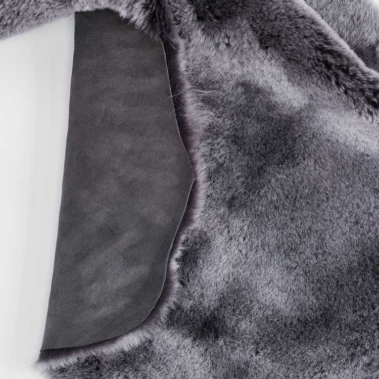 Double size British shorn sheepskin throw in shades of grey, silver, & charcoal. Extremely soft and beautifully finished 