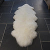 Double sheepskin in a natural, off-white colour. Silky soft made from two sheepskins sewn together. From The Wool Company