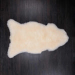 Beautifully soft natural white undyed XL sheepskin thick and luxurious. Fleece length varies between rugs and the seasons.
