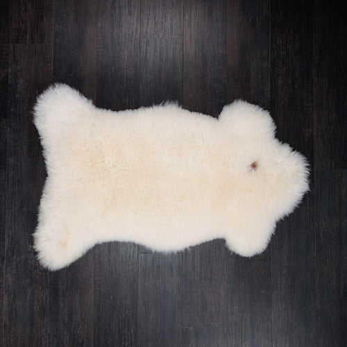 Natural white undyed sheepskin thick and luxurious. Fleece length varies between rugs and the seasons. From The Wool Company 