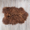 Undyed Icelandic sheepskin, chocolate brown with blonde highlights flecked across the fleece. Silky soft By The Wool Company