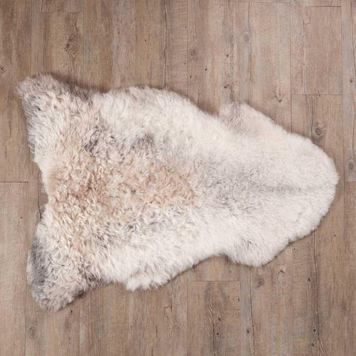 Undyed, shorn Icelandic sheepskin, greys, and browns flecked through a natural white soft fleece, From The Wool Company 