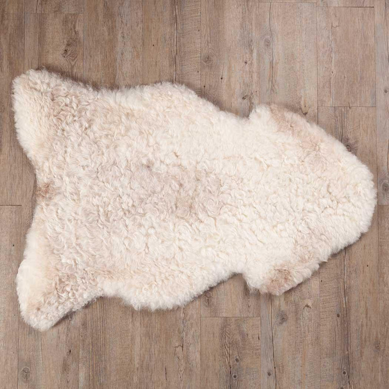 Undyed, shorn Icelandic sheepskin, greys, and browns flecked through a natural white soft fleece, Eco tanned real sheepskin