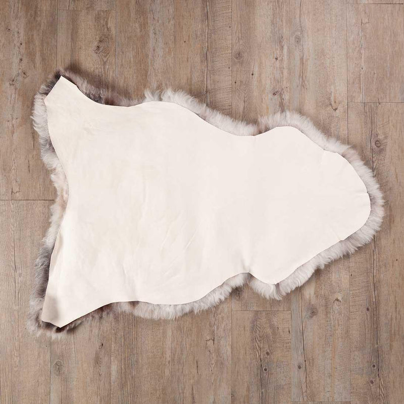 Undyed, shorn Icelandic sheepskin, greys, and browns flecked through a natural white soft fleece, Eco tanned real sheepskin